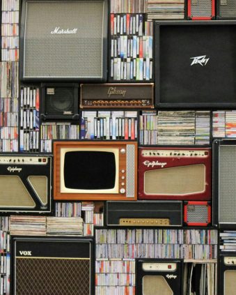 pexels photo 351265 351265 A wall of vintage speakers and TVs surrounded by books and records in a creative display.